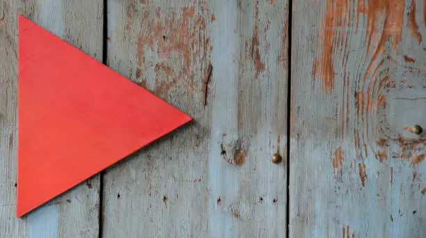 red  sign on wooden wall and background
