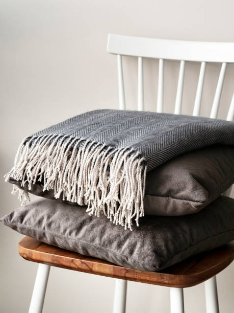istock pillow and Cushions with blanket on the chair, 1125859283