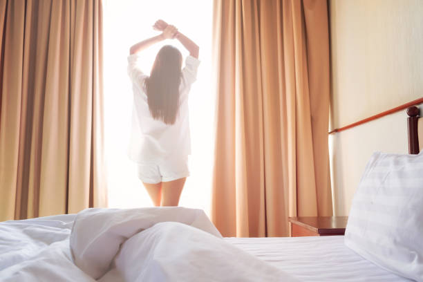 istock Woman stretching in bed after wake up. 1125859313