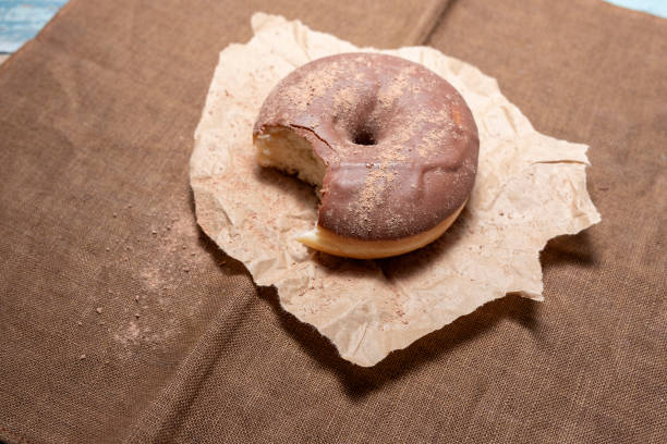 istock A delicious chocolate donut in the table 1125862740