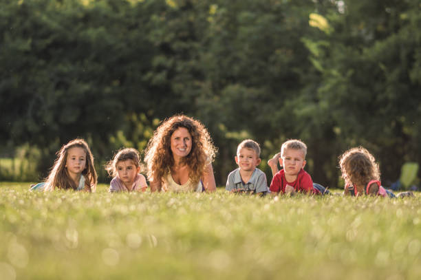 istock Group of happy children having fun in nature 1125864217
