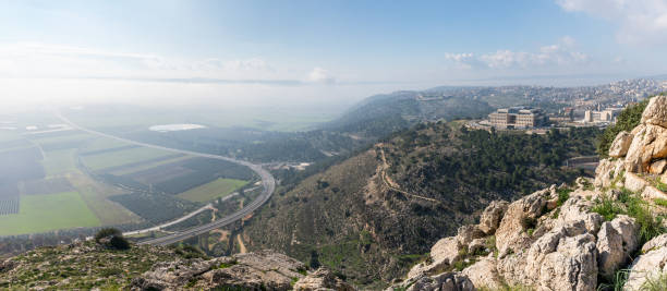 view  of the sunrise from the mount precipice near nazareth on the adjacent valley - horizon over land israel tree sunrise imagens e fotografias de stock