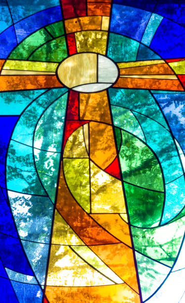 istock Stained glass cross in bright vivid colors 1125867952