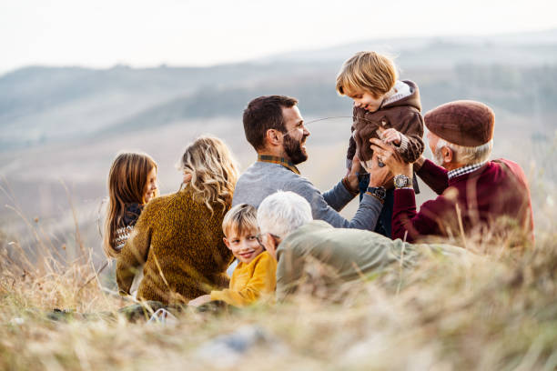 istock Happy multi-generation family having fun during autumn day on picnic. 1125868374