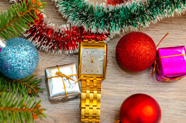 istock Christmas decoration ,  clock on wooden background 1125869052