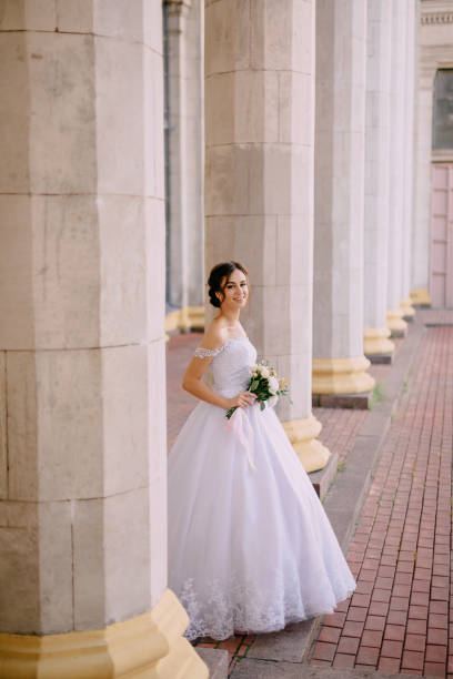 istock portrait of young bride near columns 1125872136