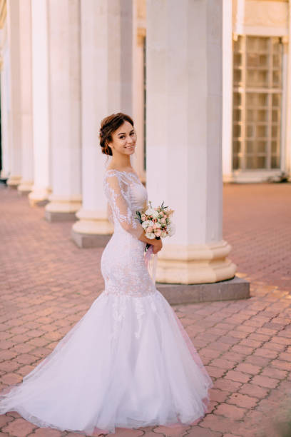 istock portrait of young bride near columns 1125872142