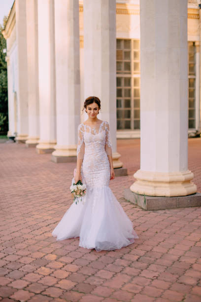 istock young bride goes near the columns 1125872143