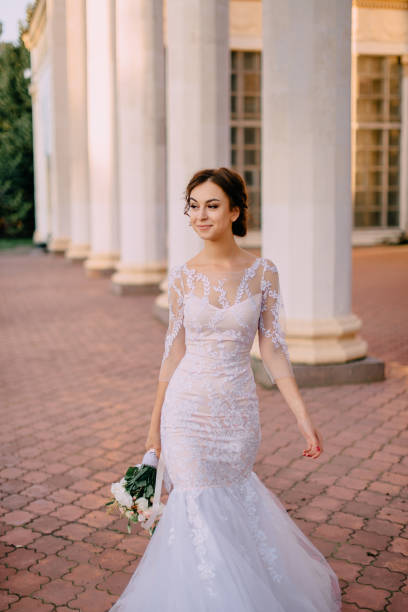 istock young bride goes near the columns 1125872149