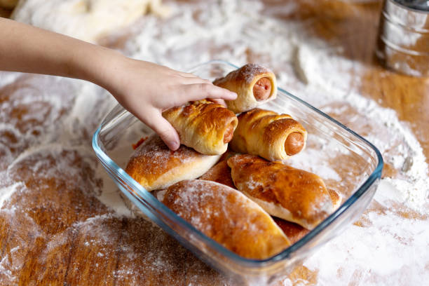 istock children's hand reaches for a homemade bun 1125872278