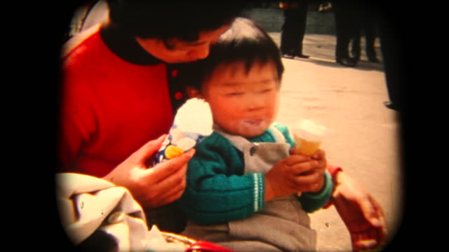 60's 8mm footage - Mother and son eating an ice cream