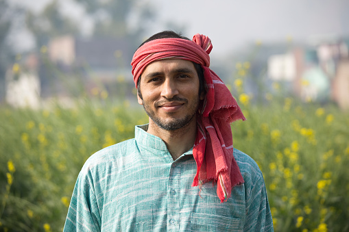Indian farmer standing in agricultural field
