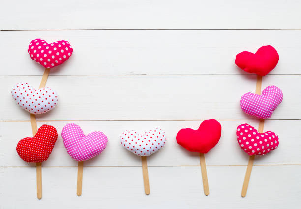 istock Valentine's hearts on white wooden background. 1125873520