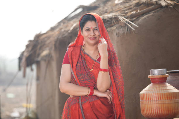 istock Indian woman standing at village 1125873527