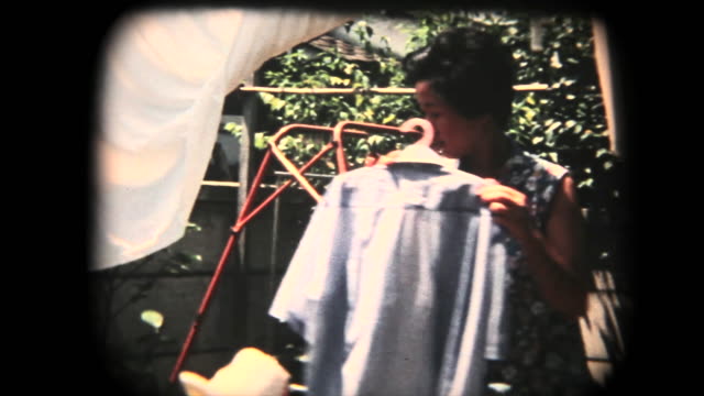 60's 8mm footage - hanging clothes after laundry