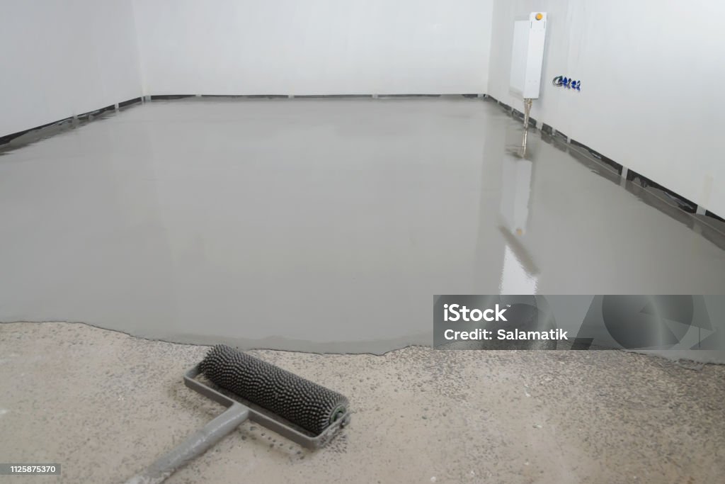 Self-leveling epoxy. Leveling with a mixture of cement floors Flooring Stock Photo