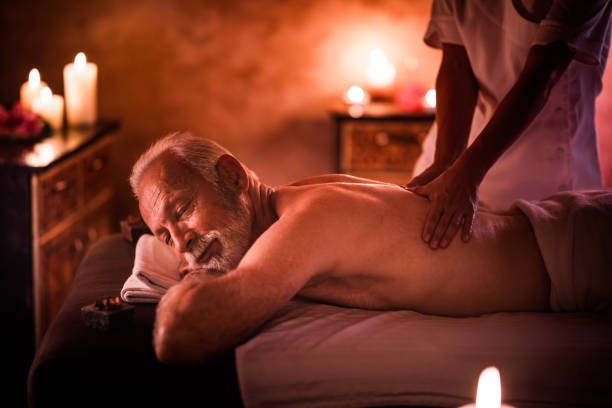 istock Relaxed senior man having back massage in the spa. 1125876632