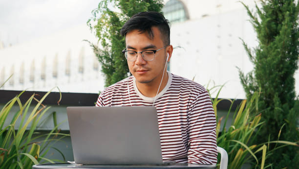 istock Asian millennials with laptop at the rooftop 1125876953