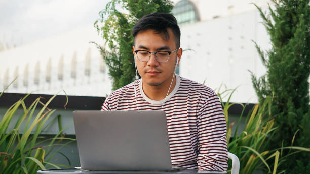 istock Asian millennials with laptop at the rooftop 1125876955