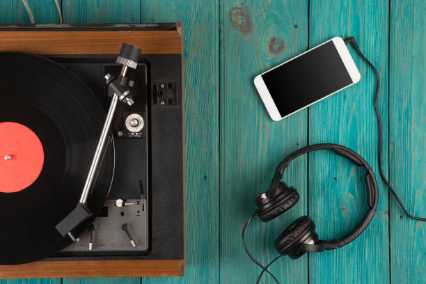 Vintage turntable, smartphone and headphones