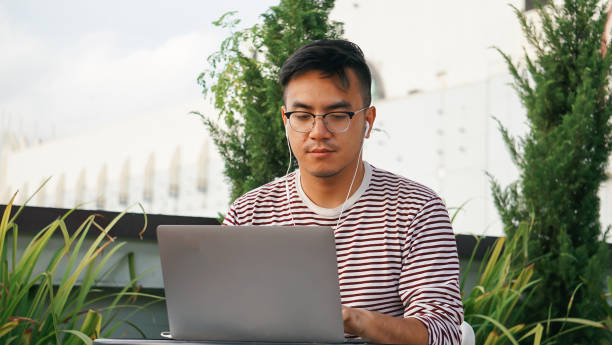 istock Asian millennials with laptop at the rooftop 1125876982