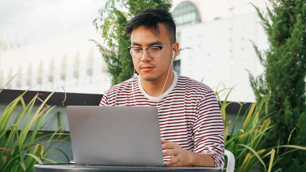 istock Asian millennials with laptop at the rooftop 1125876983