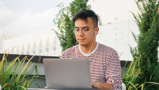 istock Asian millennials with laptop at the rooftop 1125876985