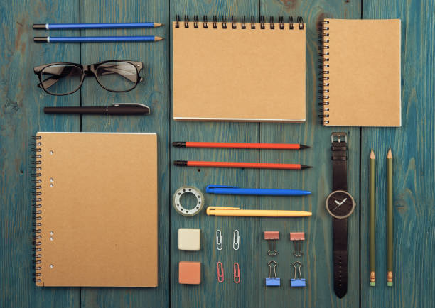 istock Workplace with notepad, glasses, watch and other office supply on a desk 1125877062