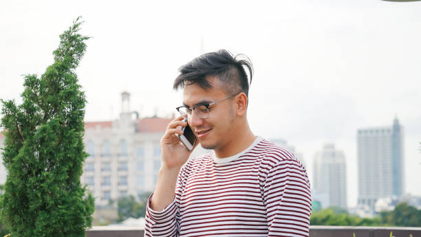 istock Asian millennials talking on the Smartphone 1125877071