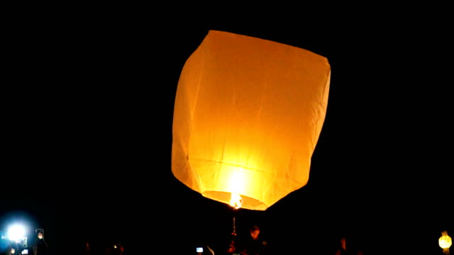 Tourist gathered during launching large floating lantern