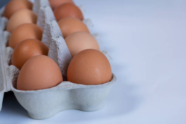 istock chicken eggs in a cardboard tray on background 1125878122