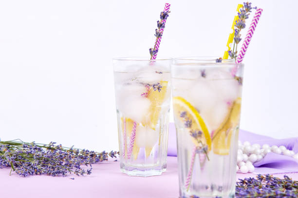 istock Lavender lemonade with lemon and ice on purple background. 1125878846