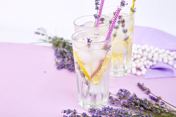 istock Lavender lemonade with lemon and ice on purple background. 1125878864