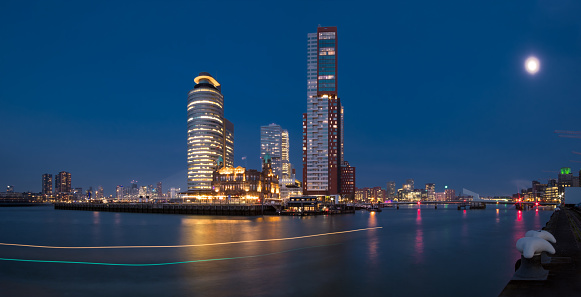 Illuminated skyscrapers on Kop van Zuid, in Rotterdam.