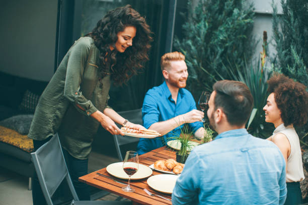 istock Cheerful young people have lunch in the courtyard and have a fun 1125880505