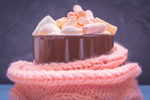 Marshmallow in a cup with a hot drink closeup