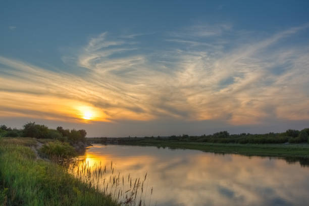 istock Summer landscape with sunset and river outdoors 1125882456