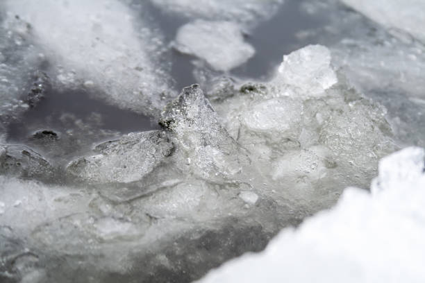 istock Ice melting on the river. Ice floes in water 1125885657