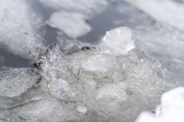 istock Ice melting on the river. Ice floes in water 1125885671