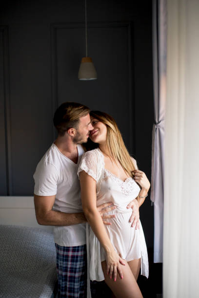istock Loving couple huging in the room 1125886087