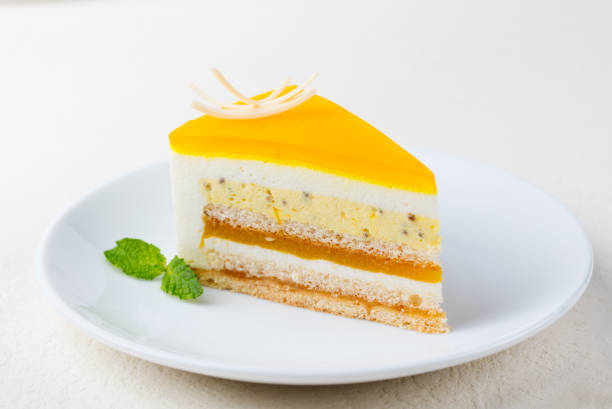 istock Passion fruit cake, mousse dessert on a white plate. 1125886634