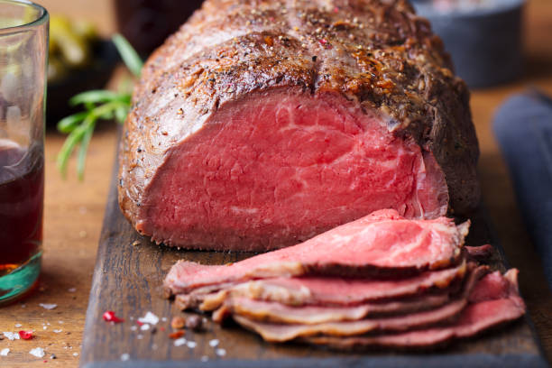 istock Roast beef on cutting board. Wooden background. Close up. 1125886856