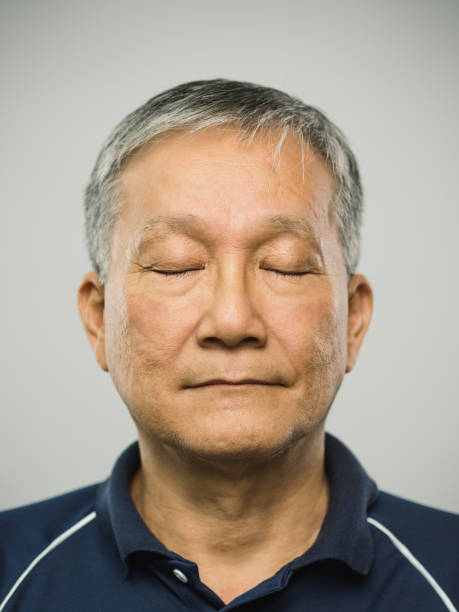 istock Real chinese senior man with blank expression and eyes closed 1125887293