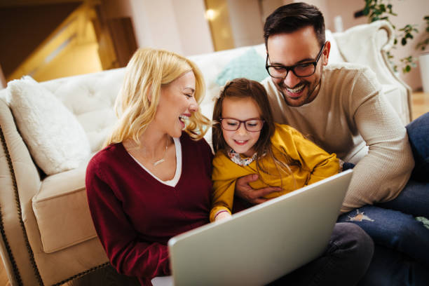 istock Family using laptop at home 1125888630