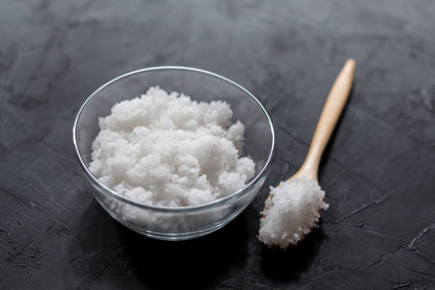istock Salt in a cup on a wooden table 1125888834