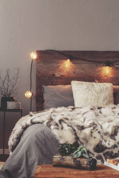 istock Copy space on empty grey wall of winter bedroom with warm bed 1125890473