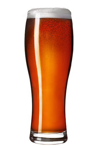 Craft dark amber ale beer in a weizen glass isolated on white background. Studio shot.