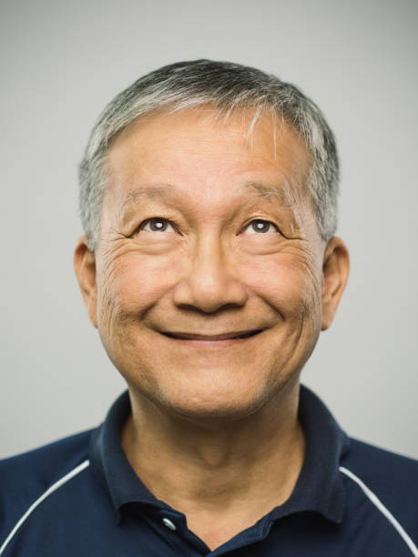 istock Real chinese senior man with happy expression looking up 1125891900