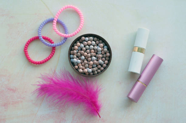 istock Blush balls, lipstick, gum on a pink background 1125892248