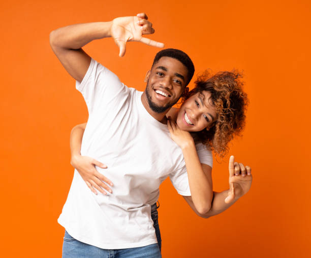 istock Couple having fun taking picture with imaginary camera 1125892482
